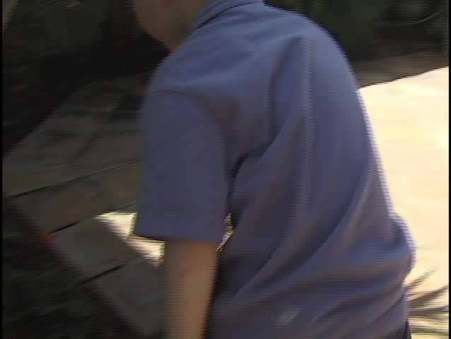 A young boy hunts for Easter eggs.