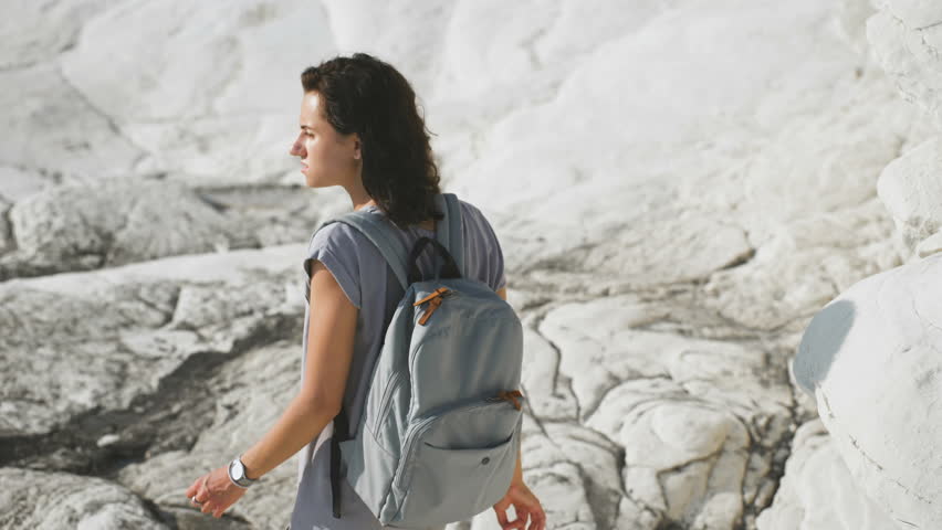 Tourism. young woman hiking in the mountains