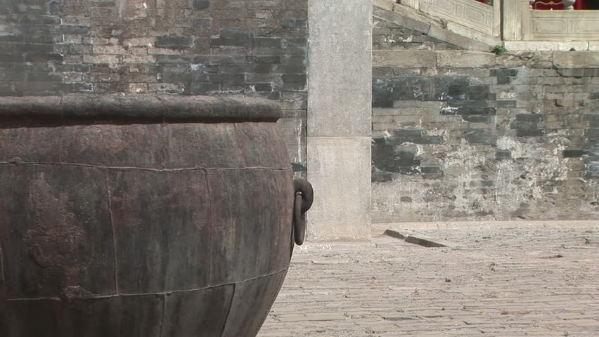 Ancient Chinese Fire Extinguisher Bronze pot containing water in case of fire, Forbidden City, Beijing, China, zoom out