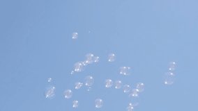 Lot of transparent soap bubbles floating in the clear blue sky slow-mo 1920X1080 HD video - Slow motion soap-bubbles in the air relaxing background 1080p FullHD footage