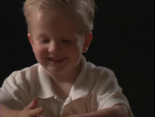 A young boy smiles.
