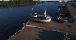 Aerial view drone video of Helsinki power plant area, islands, Helsinki zoo island and visible remains of sunken ship at Sompasaari