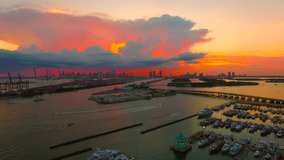 AERIAL - Amazing 4K footage of a Sunset in Miami Beach - South Beach Florida with a beautiful dusk sky. Clouds on fire - Storm