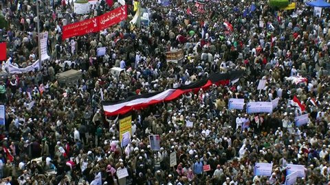 CAIRO, EGYPT - NOV 19: Big Egyptian flag on the crowd in Tahrir square on November 19, 2011 in Cairo. 