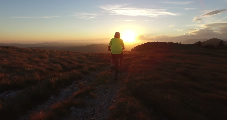 Mountain biker riding at sunset