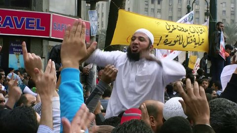 CAIRO, EGYPT - NOV 19, 2011: Arabic protesters in Tahrir Square sing slogan on November 19, 2011 in Cairo. 