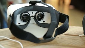 Virtual reality (VR) headsets (glasses) from behind. VR is immersive multimedia or computer-simulated reality - a computer technology that replicates an environment. - Powered by Shutterstock - Get 15% off with code: PIKWIZARD15