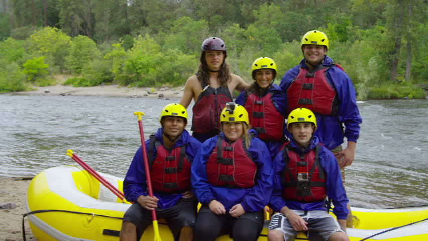 Group portrait of people white water rafting
