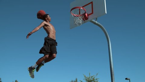 Super slow motion shot of basketball basketball slam dunk, shot on Phantom Flex 4K