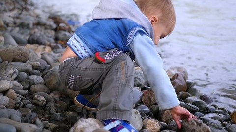 Child Throwing Stones Into River Stock Footage Video (100% Royalty-free ...