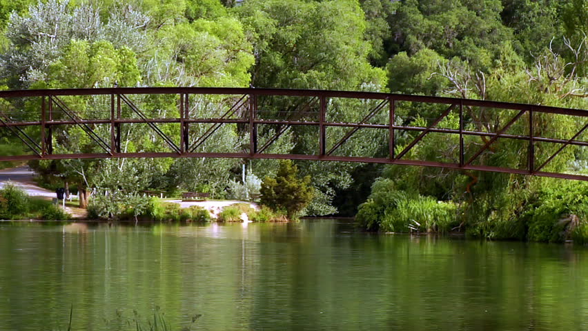 An HD clip of a beautiful bridge over a small lake. 