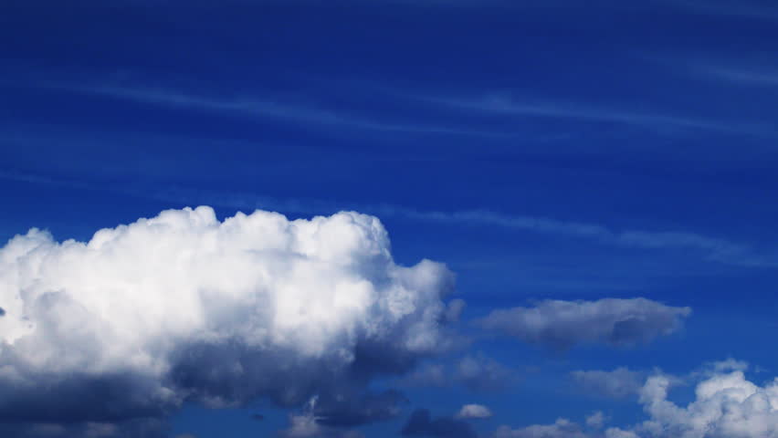 A beautiful time lapse of big clouds against a very blue sky. 