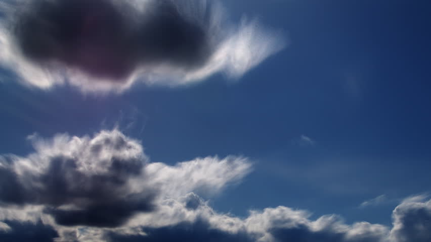 A beautiful time lapse of clouds against a very blue sky. 