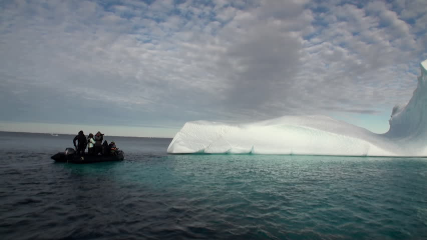Big Iicebergs floating in sea around Greenland in icefjords. Fantastic wonderful amazing video grenland nature iceland. Lovely shooting the life of nature, seaside and mountains. Global warming.