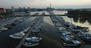 Aerial view of Helsinki bay area and drone video of old city skyline, boats and yachts in Helsinki harbour, the capital of Finland