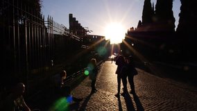ROME, ITALY -- OCT 26, 2013 Sunburst sunrise on street outside of Colosseum (Coliseum) in Rome Italy - Powered by Shutterstock - Get 15% off with code: PIKWIZARD15