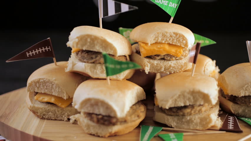 Sliders with veggie tray on the table for the football party.