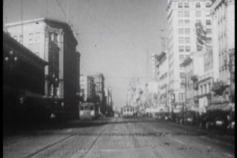 Cables cars travel on Market Street and aerial shots of San Francisco in the 1930s. (1930s)