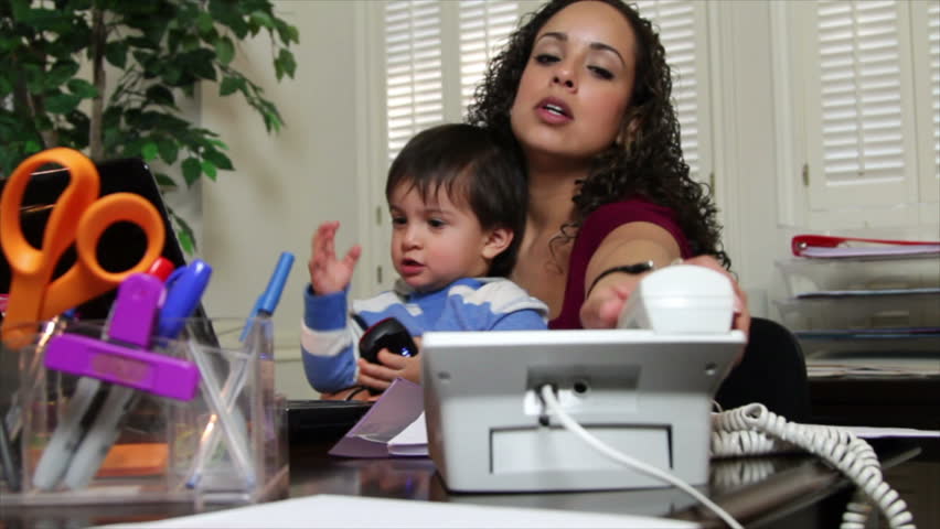 With daycare facilities shutdown due to COVID19 a young single mom struggles to work from home and manage her little boy. Royalty-Free Stock Footage #1906246