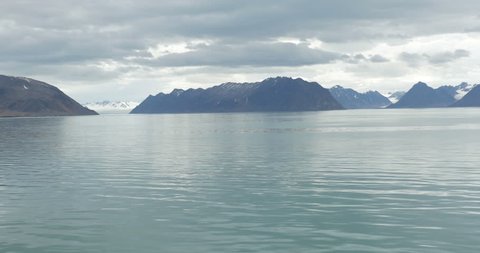 Lake Mountains and snow view from Spitsbergen Norway
Beautiful lake and snowy mountains from Spitsbergen Norway wide shot in 4K resolution

