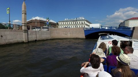 ST.PETERSBURG, RUSSIA - July 2, 2016: Tourists and travelers make the river walk along the rivers and canals of St. Petersburg, Russia