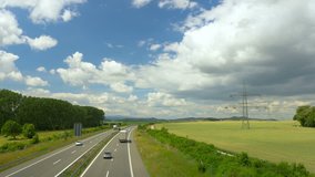 Highway in sunny landscape. Transport in Germany, Europe. Clip contains road, truck, bridge, modern	
