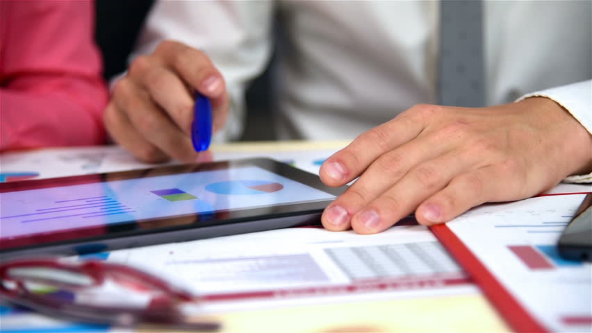 Businesspeople Examining Business Charts On Digital Tablet. Slow Motion Effect | Shutterstock HD Video #19098310
