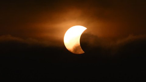 The Moon covering the Sun in a partial eclipse.
