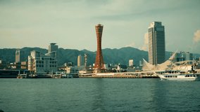 View of Kobe bay with arriving ship and Port Tower. 4K resolution retro look. 2016