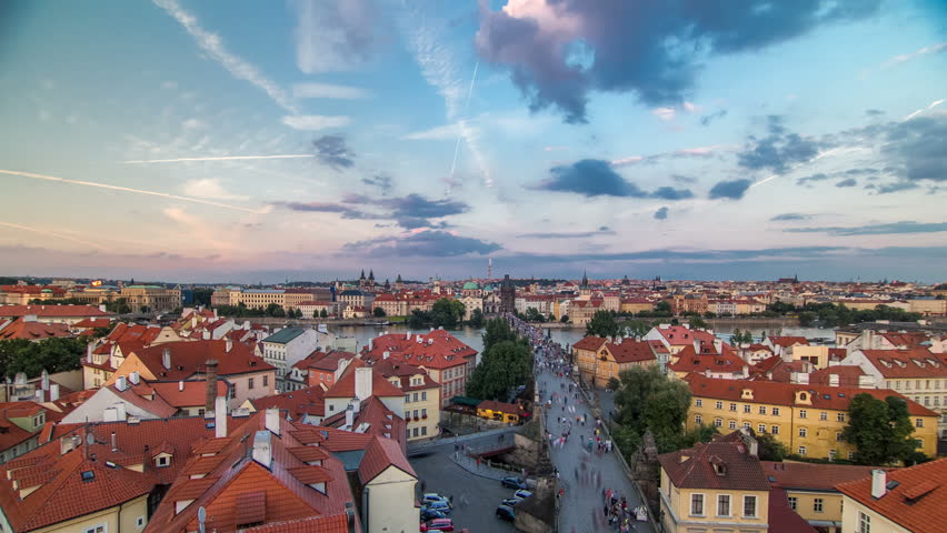 Scenic summer aerial view of the Old Town pier architecture and Charles Bridge over Vltava river timelapse in Praha. Prague, Czech Republic. Top view from Lesser Town Tower