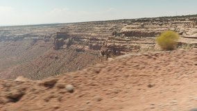 video from driving car of scenic desert abyss road, Utah, USA