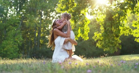 ecology, young mother with her adorable two year old girl playing outdoors with love.
concept of family love of nature. happy children with the love of parents. concept of green and sustainability. - Βίντεο στοκ