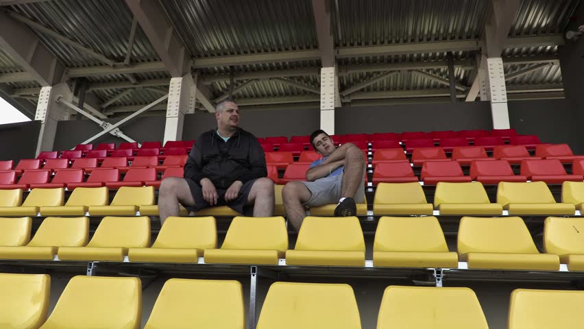 Sports fan awakened friend in stadium