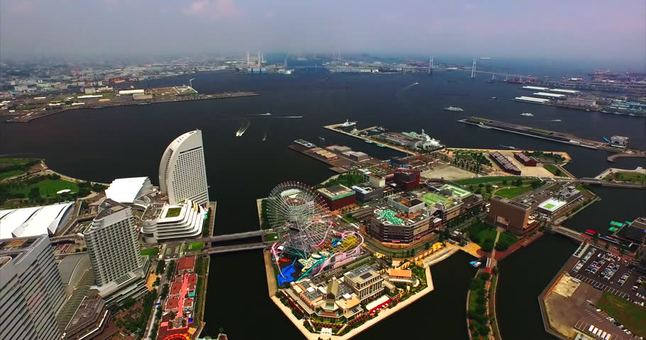 The Yokohama Bay Bridge closes off the harbour behind the red brick warehouses and cruise piers.