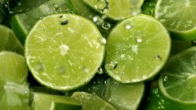 Limes Cut  with Water Drops Super Slow Motion  - Powered by Shutterstock - Get 15% off with code: PIKWIZARD15