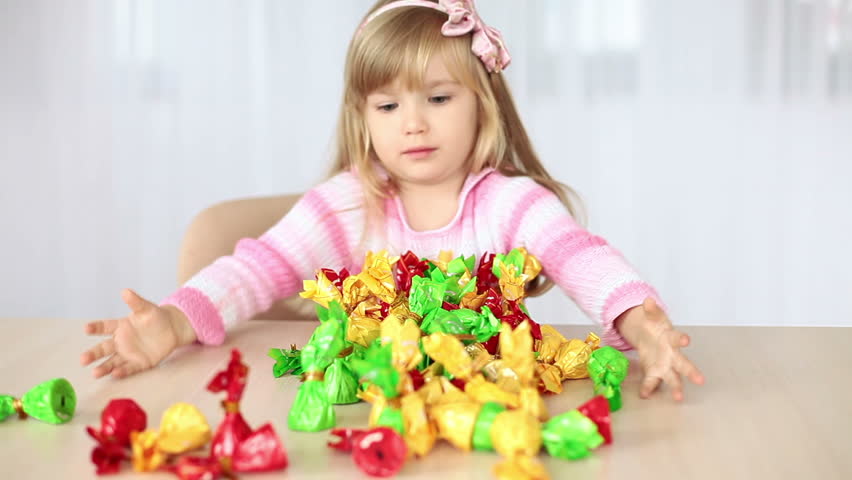 Little girl enjoys sweets