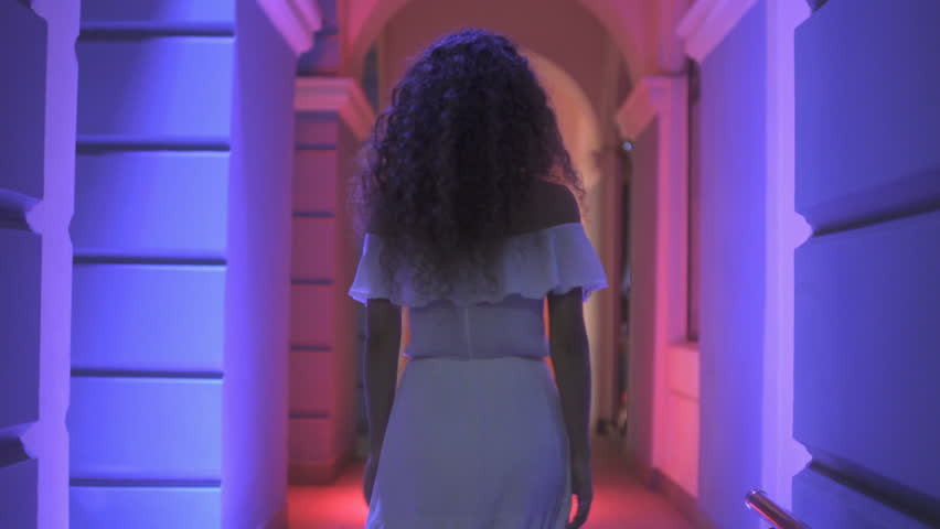 3 in 1 video! The woman walk along the column. Night evening time. Wide angle. Real time capture