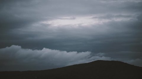 dark hill and clouds