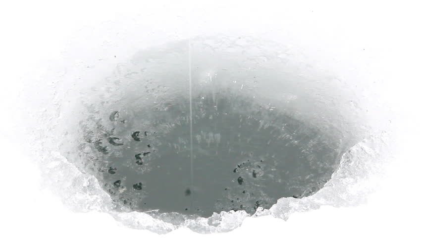 Hole drilled for ice fishing line dropped in