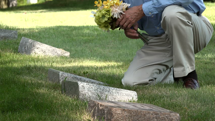 Man Placing Flowers On A Stock Footage Video 100 Royalty Free 19164814 Shutterstock