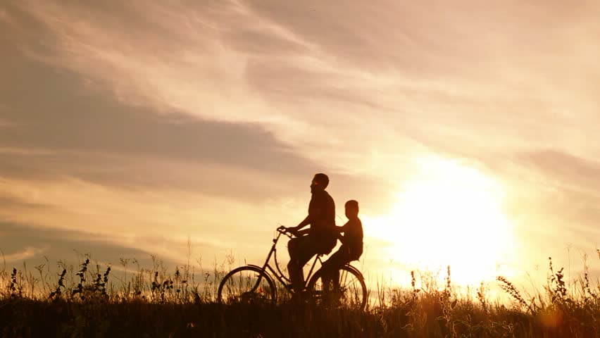 two people riding one bike