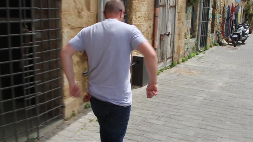 A Man Walking In The City Of Tel Aviv