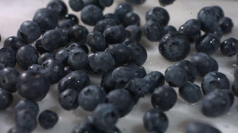 Blueberries falling in slow motion