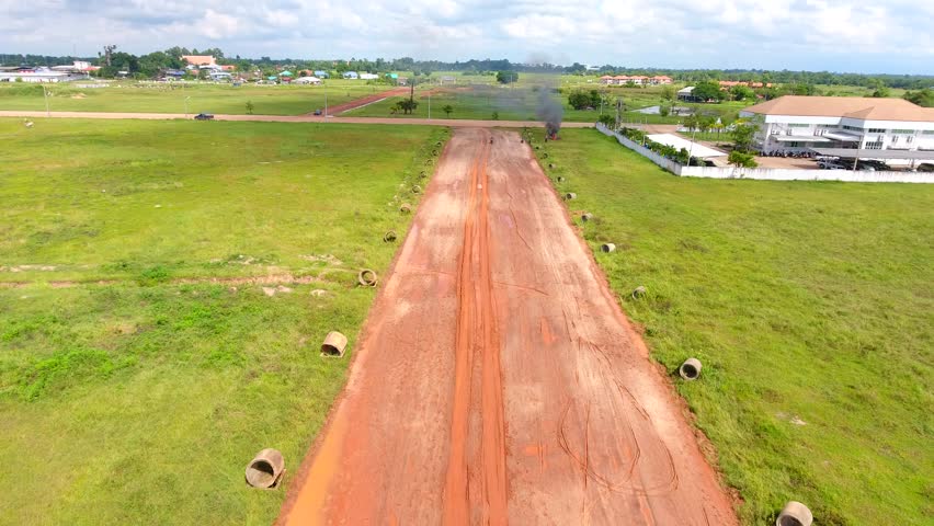 Aerial view , dirt road and field