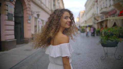 3 in 1 video! The young woman walk on the street. Slow motion. Wide angle