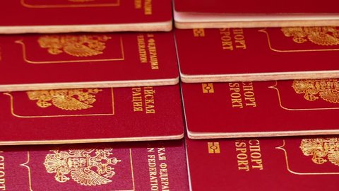 Foreign passports of the Russian Federation with a red cover.