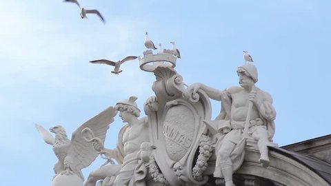 Roman statue - beautiful statue in the center of Rome, the eternal city. Seagulls pose on statues - cultural tourism concept