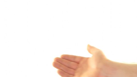 The left hand of an adult male is seen self massaging his right wrist to try and relieve some pain and discomfort in front of a white background.