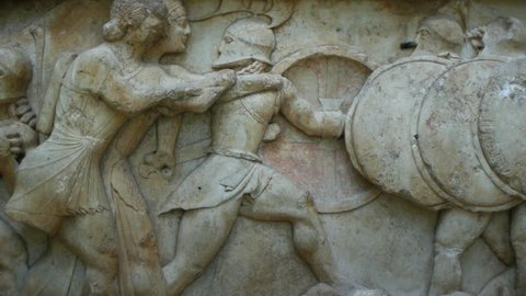 Ancient greek stone frieze representing the Gigantomachy battle