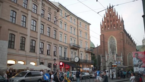 KRAKOW, POLAND - JULY 27, 2016: Krakow center - pedestrian cross the street